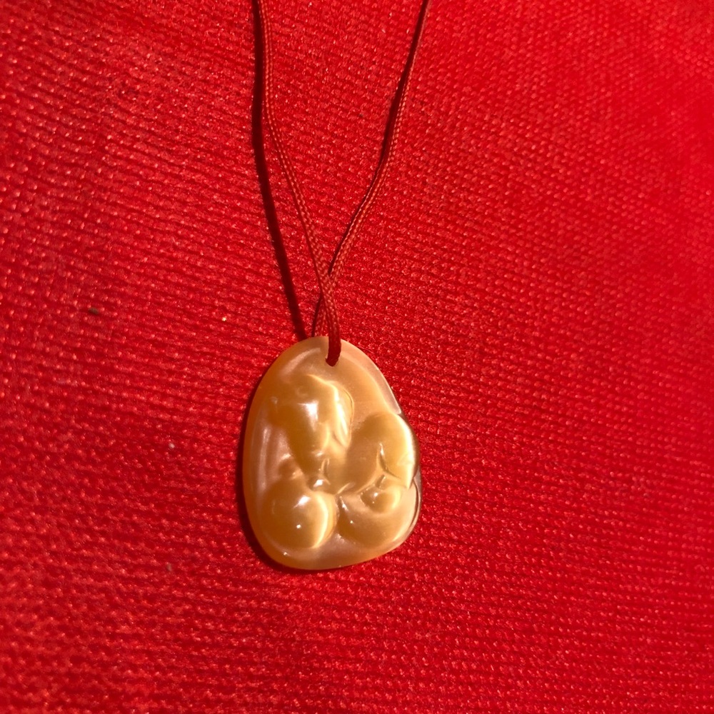 Hand-curved dog shape pendant